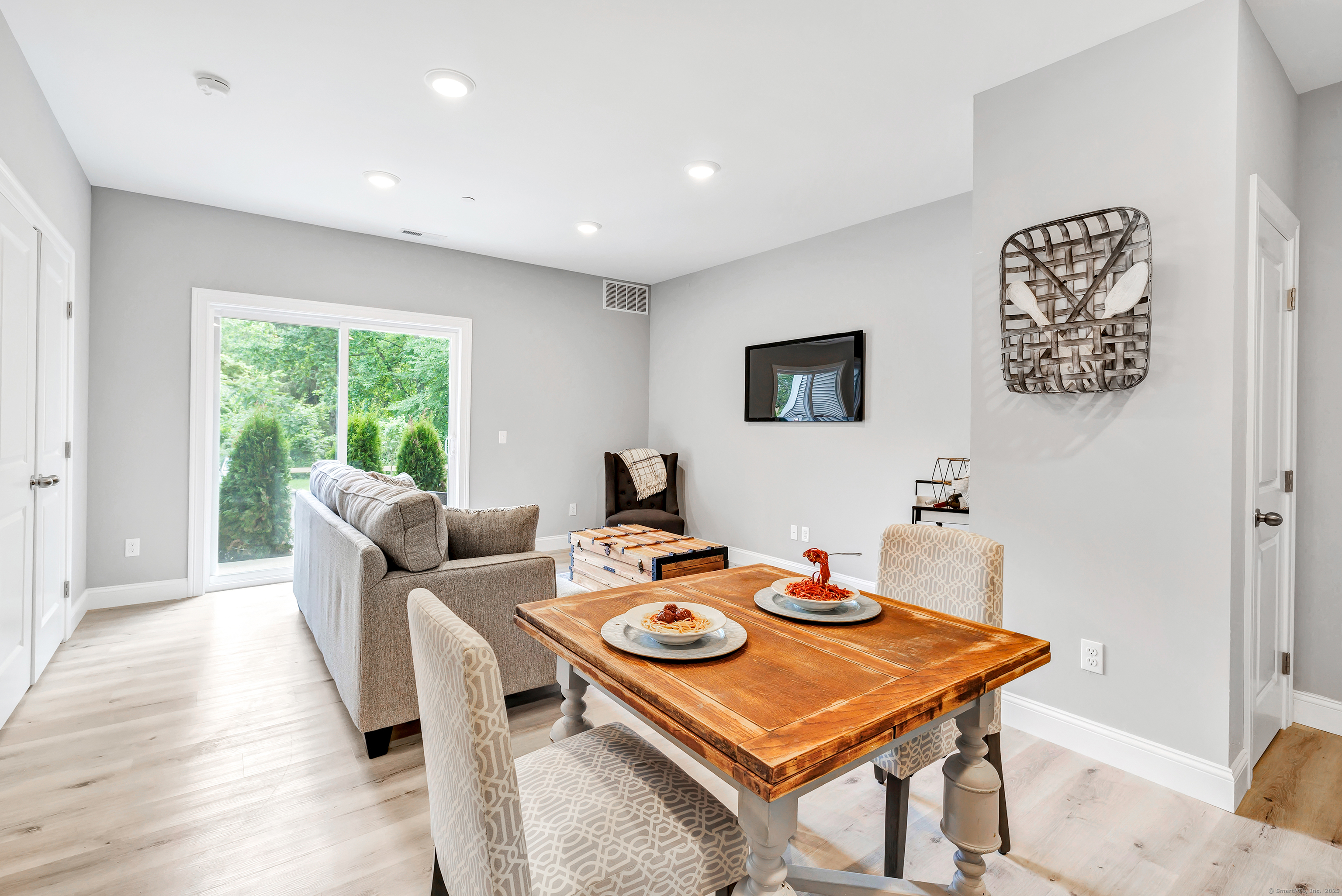 303 Bridgeport Avenue, Unit 205 Shelton, CT 06484 - Photo 9 of 36 a living room with furniture a window and a table