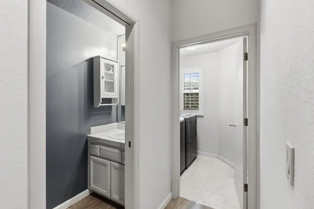 a bathroom with a sink and a mirror