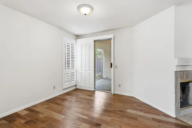 a view of an entryway with wooden floor