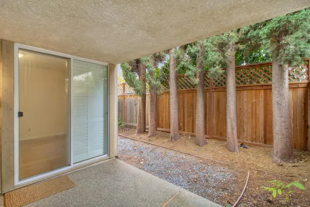 a kitchen with granite countertop cabinets and window