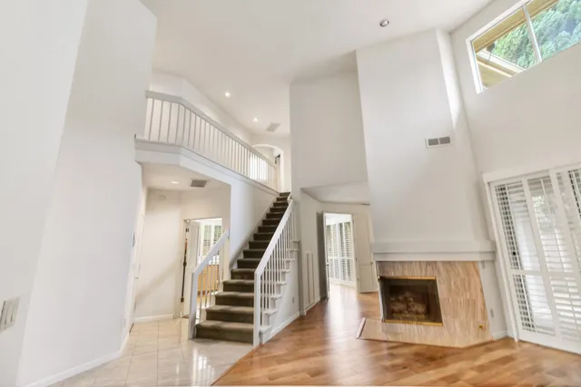 a view of hallway with wooden floor