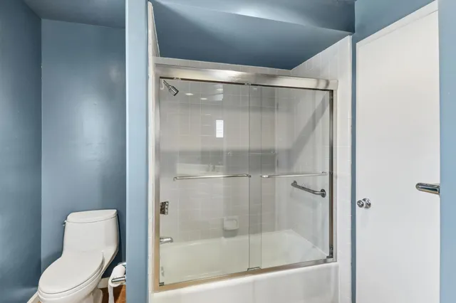 a view of empty room with windows