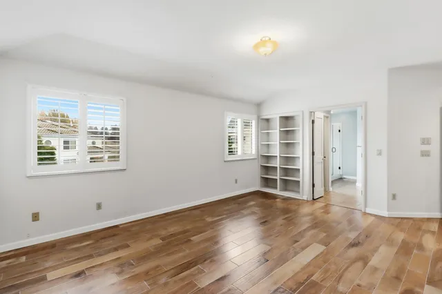 a bathroom with a shower and a window
