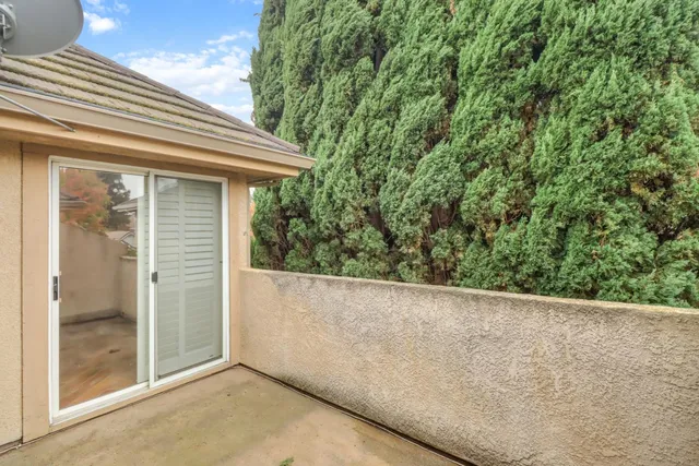 a view of a glass door and outdoor space