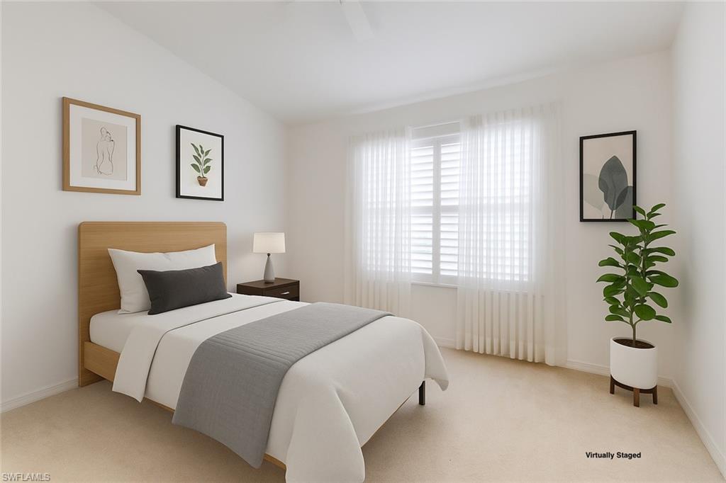 2089 Isla De Palma Circle Naples, FL 34119 - Photo 12 of 19 Bedroom with carpet flooring and multiple windows