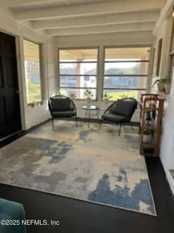 a view of a living room and window