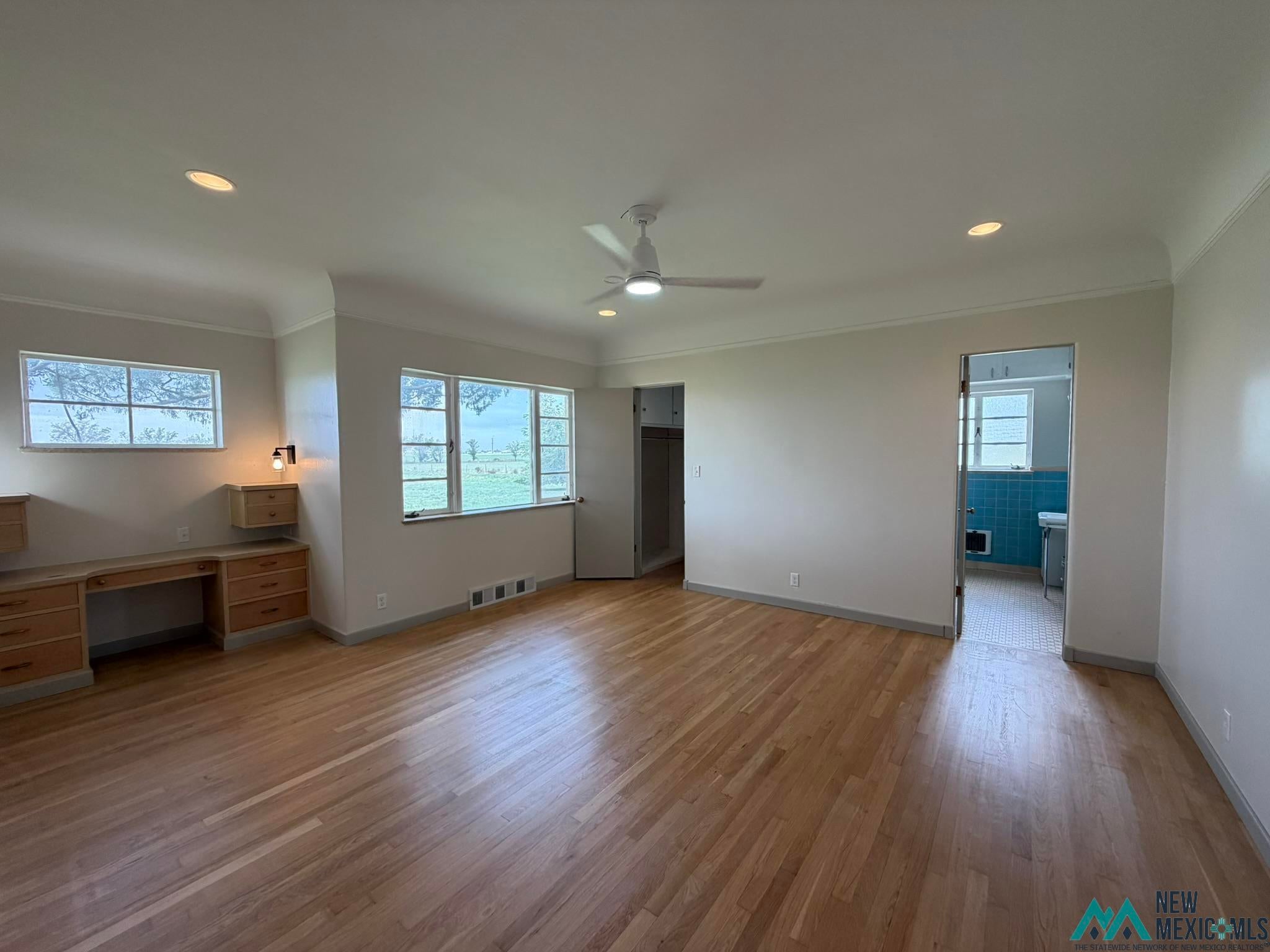 570 Curry Road North Clovis, NM 88101 - Photo 28 of 59 Spacious room featuring wood-finish flooring, recessed lighting, and a ceiling fan