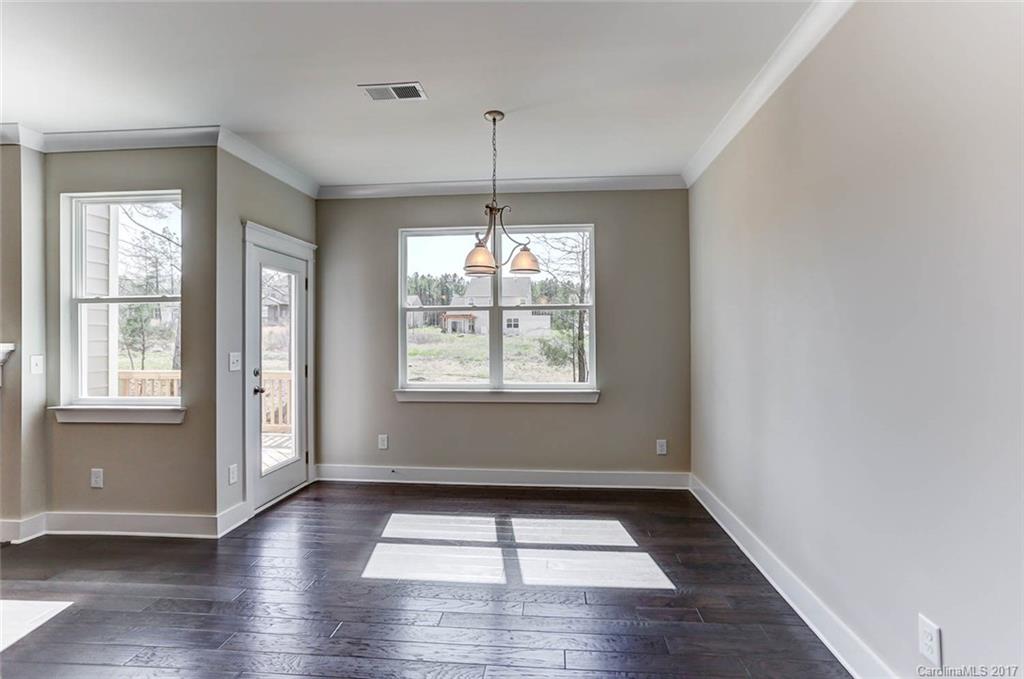 246 Hydrangea Drive Clover, SC 29710 - Photo 14 of 24 a view of an empty room with wooden floor and a window