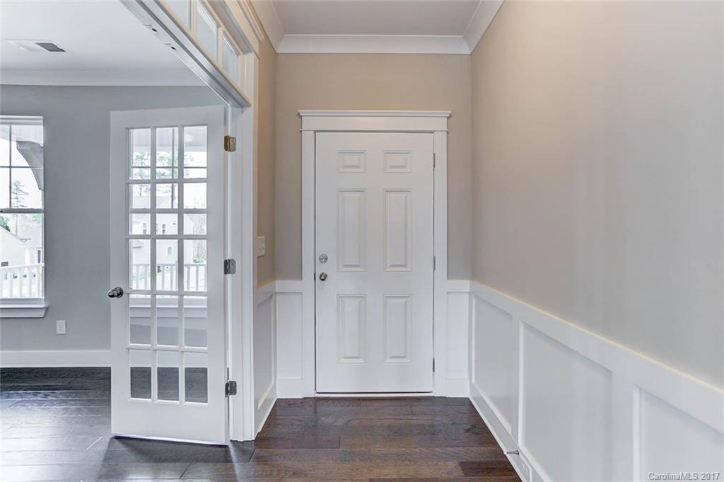 246 Hydrangea Drive Clover, SC 29710 - Photo 4 of 24 an empty room with wooden floor and windows