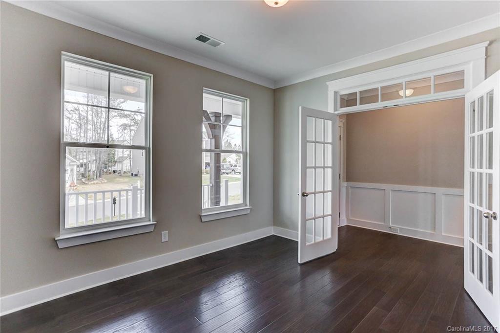 246 Hydrangea Drive Clover, SC 29710 - Photo 5 of 24 a view of an empty room with wooden floor and a window