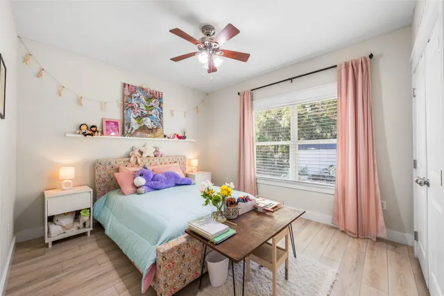 a bathroom with a granite countertop sink a toilet and a mirror