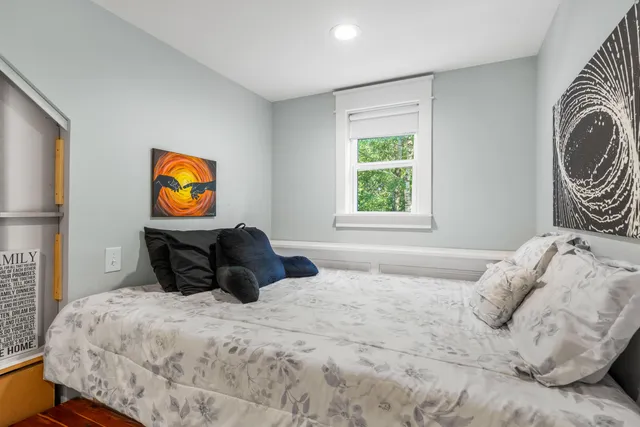a view of a house with backyard sitting area and garden