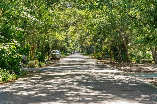 a view of a room with wooden floor staircase and windows
