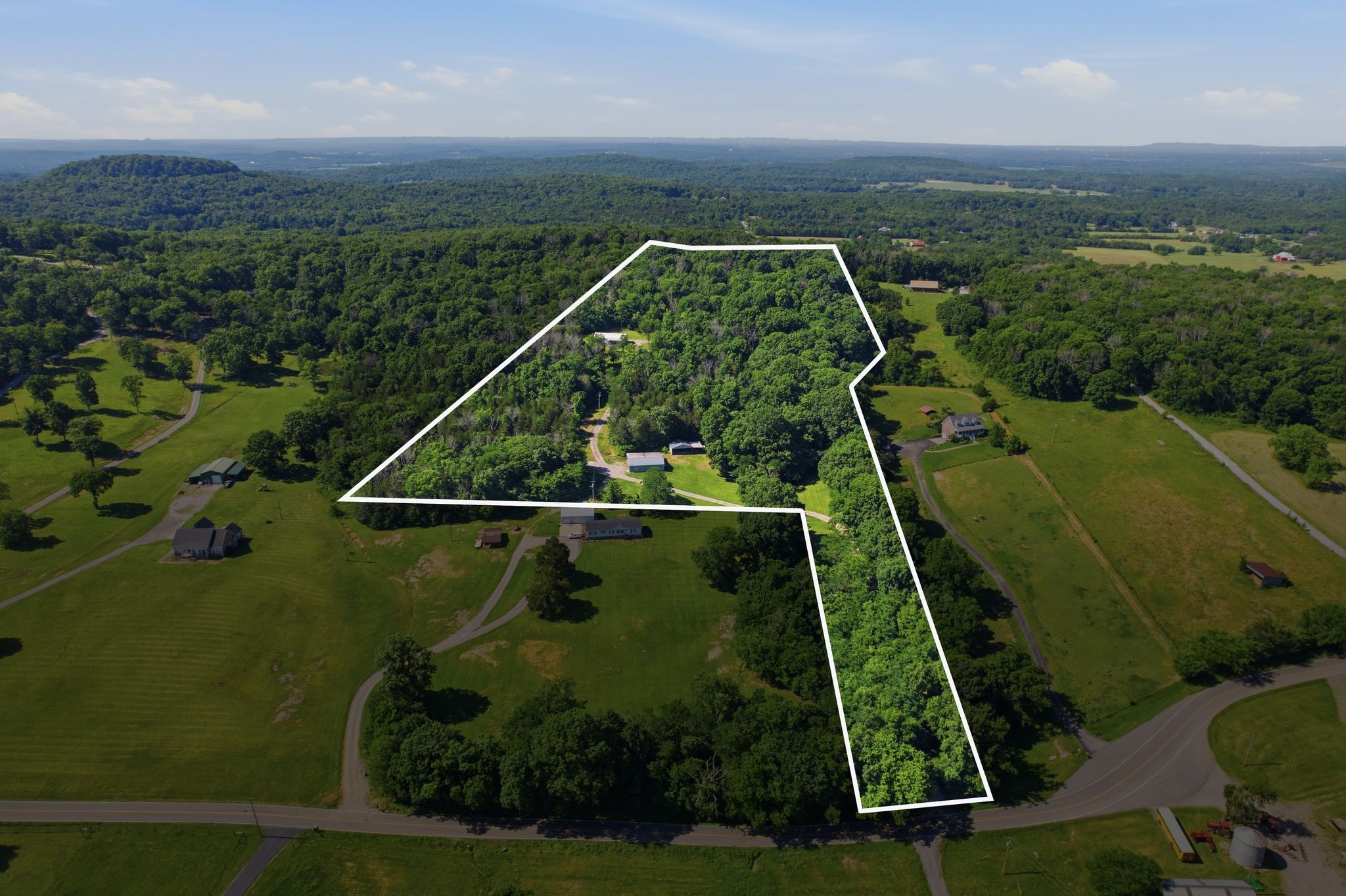 1021 B Jordan Road Lascassas, TN 37085 - Photo 3 of 58 an aerial view of a golf course with a swimming pool