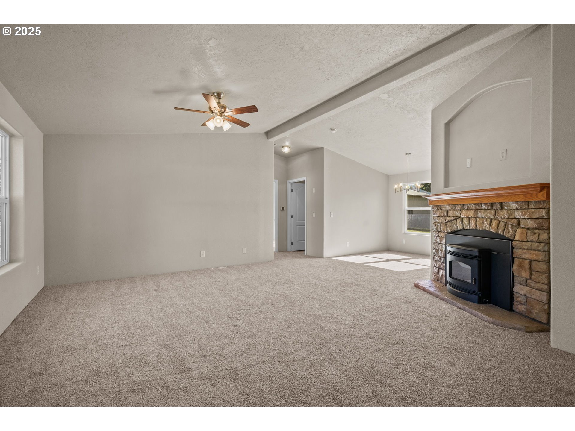 344 Southwest Ivy Street Mill City, OR 97360 - Photo 4 of 38 a view of empty room with a fireplace