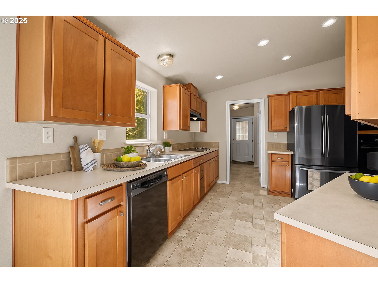 344 Southwest Ivy Street Mill City, OR 97360 - Photo 7 of 38 a kitchen with stainless steel appliances granite countertop a sink refrigerator and cabinets