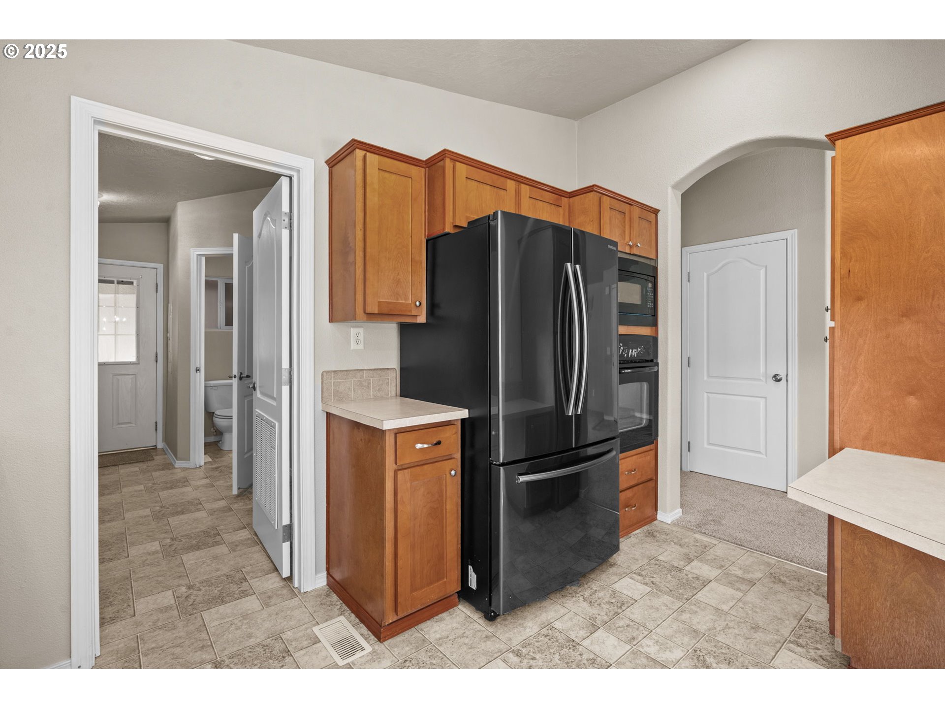 344 Southwest Ivy Street Mill City, OR 97360 - Photo 8 of 38 a kitchen with stainless steel appliances granite countertop a refrigerator and a sink