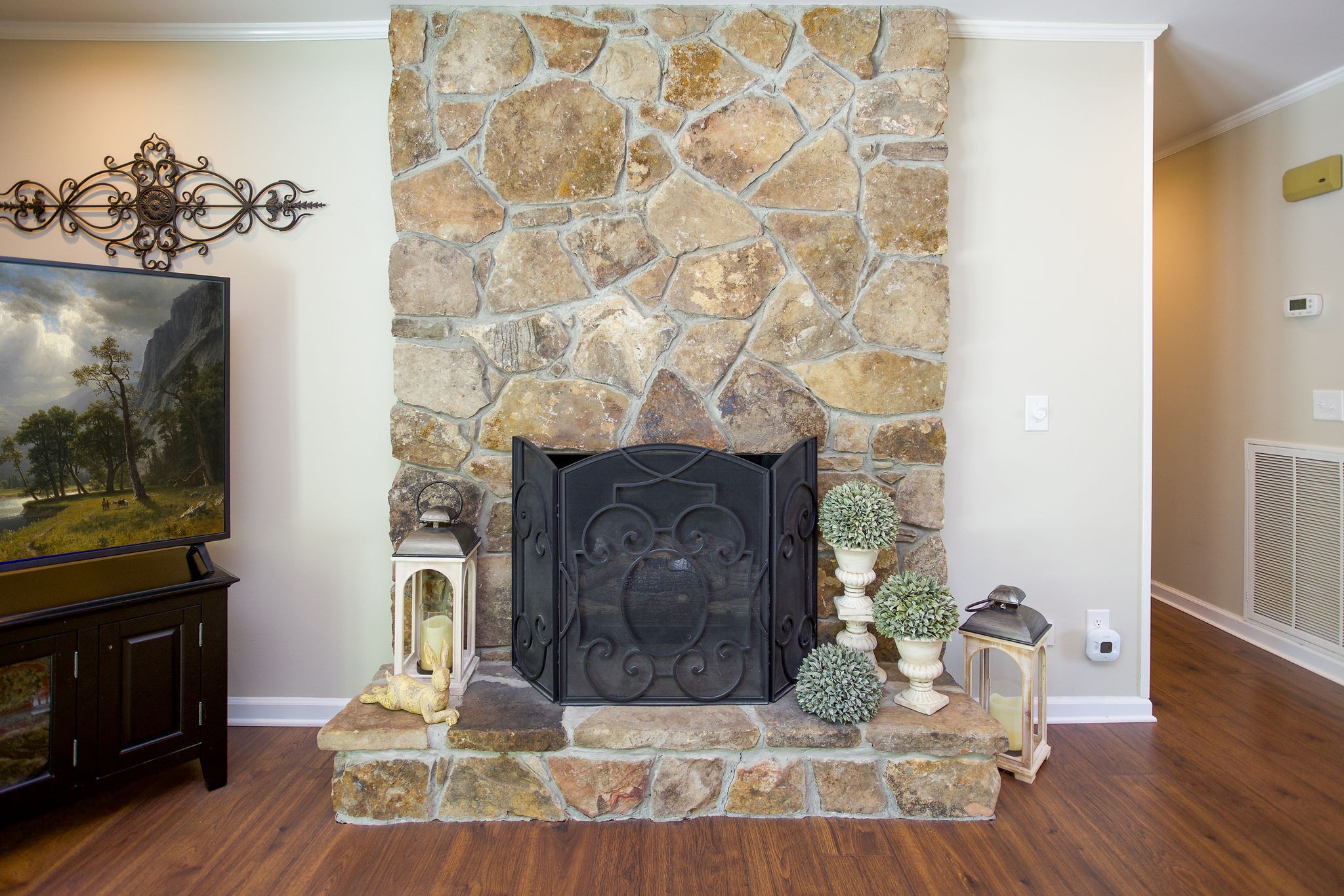 1747 Allen Ferry Road Smithville, TN 37166 - Photo 11 of 45 a view of a living room with a fireplace and wooden floor
