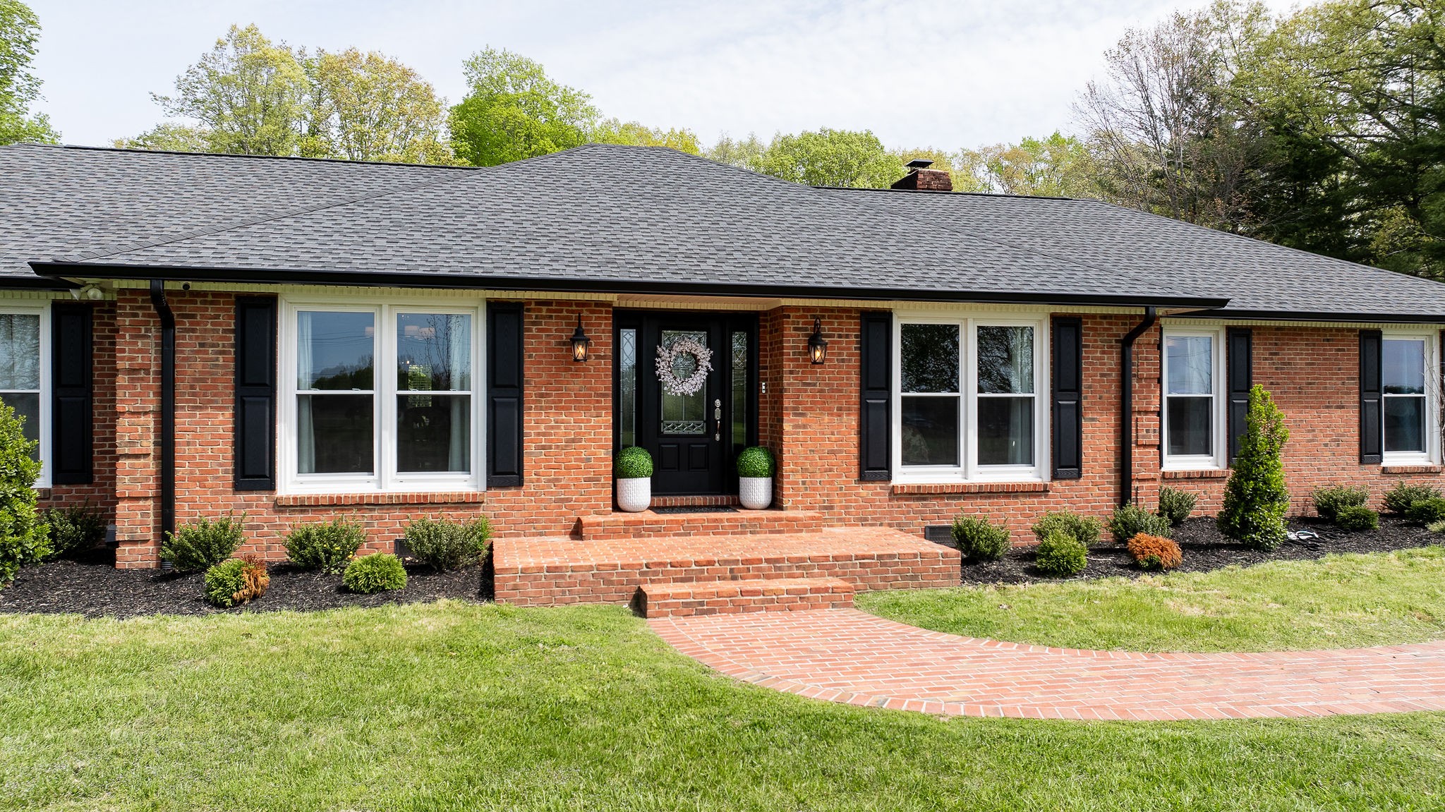1747 Allen Ferry Road Smithville, TN 37166 - Photo 2 of 45 a front view of a house with garden