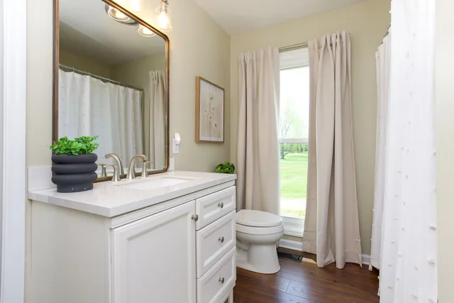 a bedroom with a bed and a chair