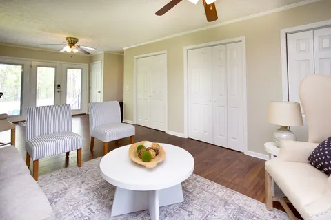 a swimming pool with trees in the background