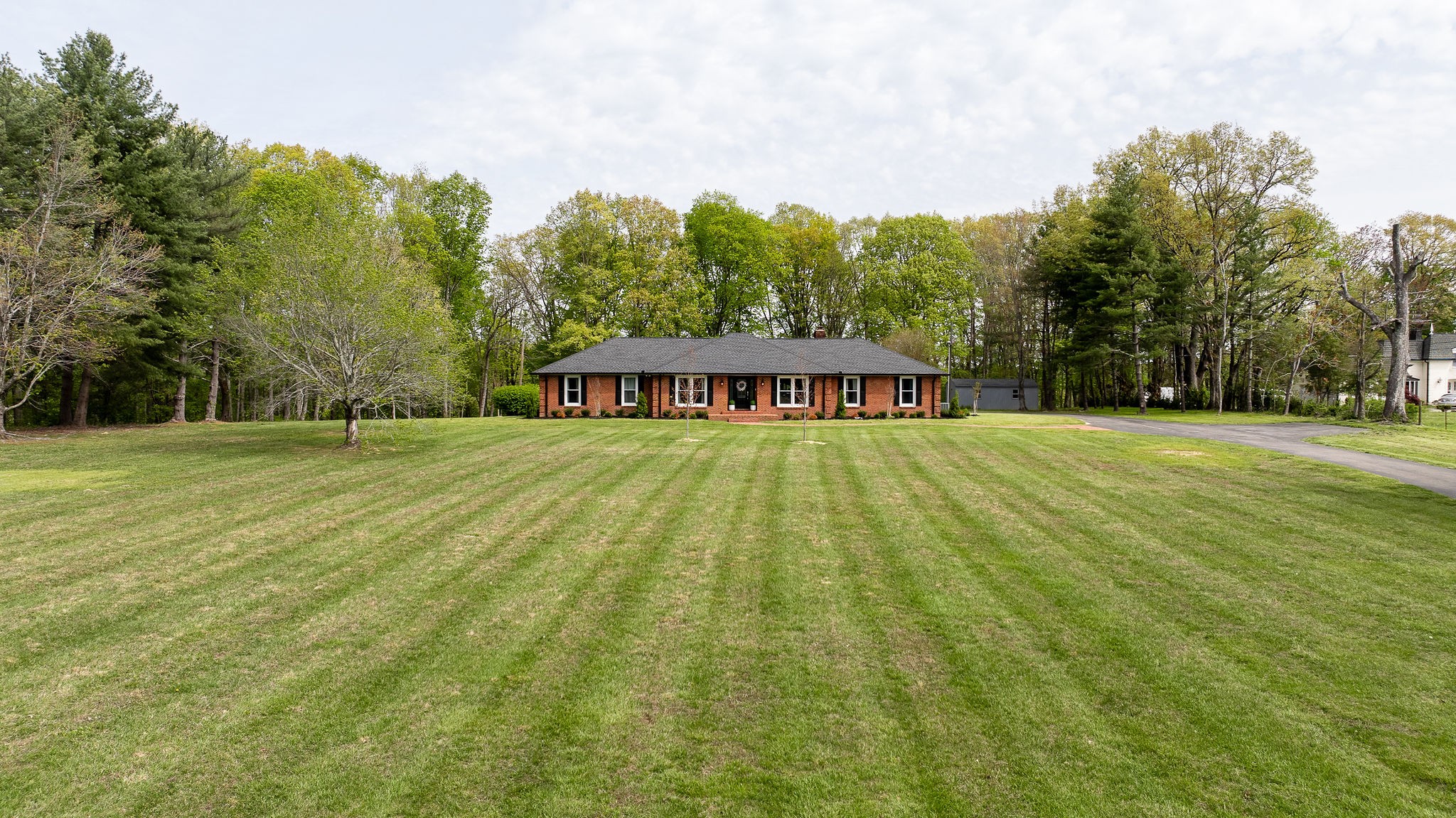 1747 Allen Ferry Road Smithville, TN 37166 - Photo 30 of 45 a view of swimming pool with outdoor seating and trees in the background