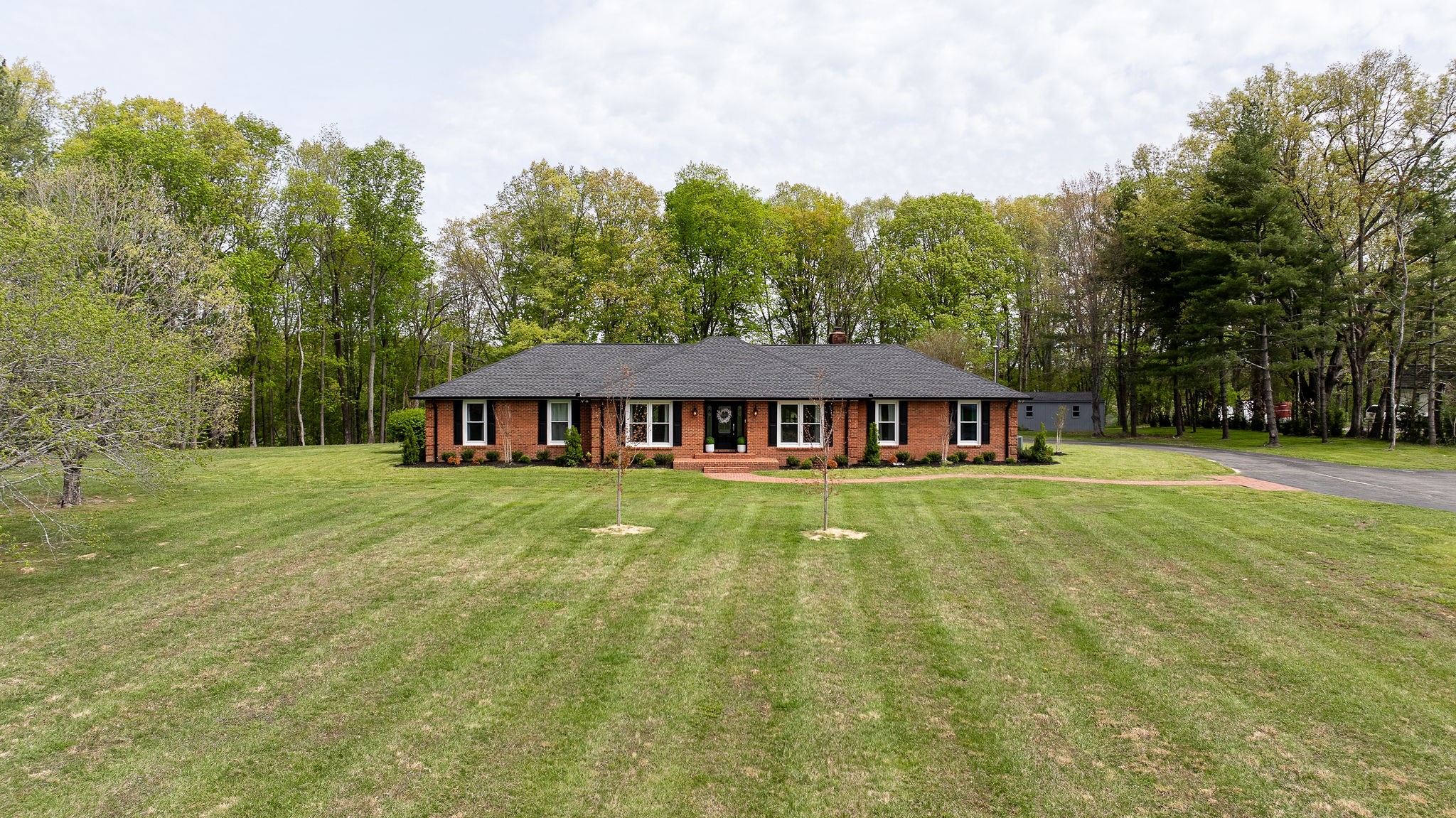 1747 Allen Ferry Road Smithville, TN 37166 - Photo 31 of 45 a view of a house with a yard