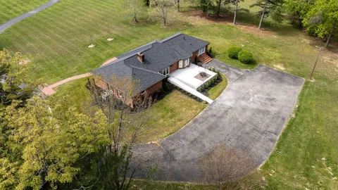a view of a garden with lawn chairs