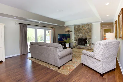 a living room with furniture and a fireplace