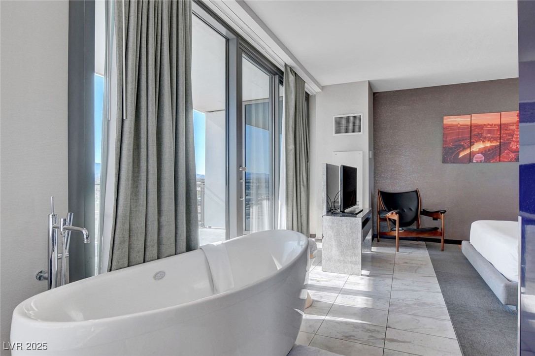 4381 West Flamingo Road, Unit 1121 Las Vegas, NV 89103 - Photo 12 of 33 Full bathroom featuring a soaking tub