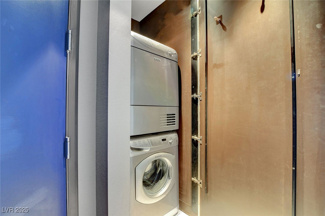 4381 West Flamingo Road, Unit 1121 Las Vegas, NV 89103 - Photo 21 of 33 Laundry room featuring stacked washer and clothes dryer
