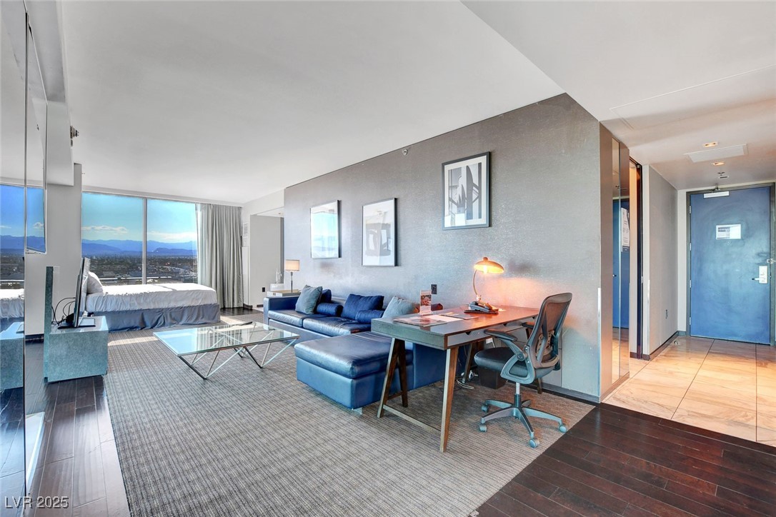 4381 West Flamingo Road, Unit 1121 Las Vegas, NV 89103 - Photo 5 of 33 Living room featuring hardwood / wood-style floors and an office area