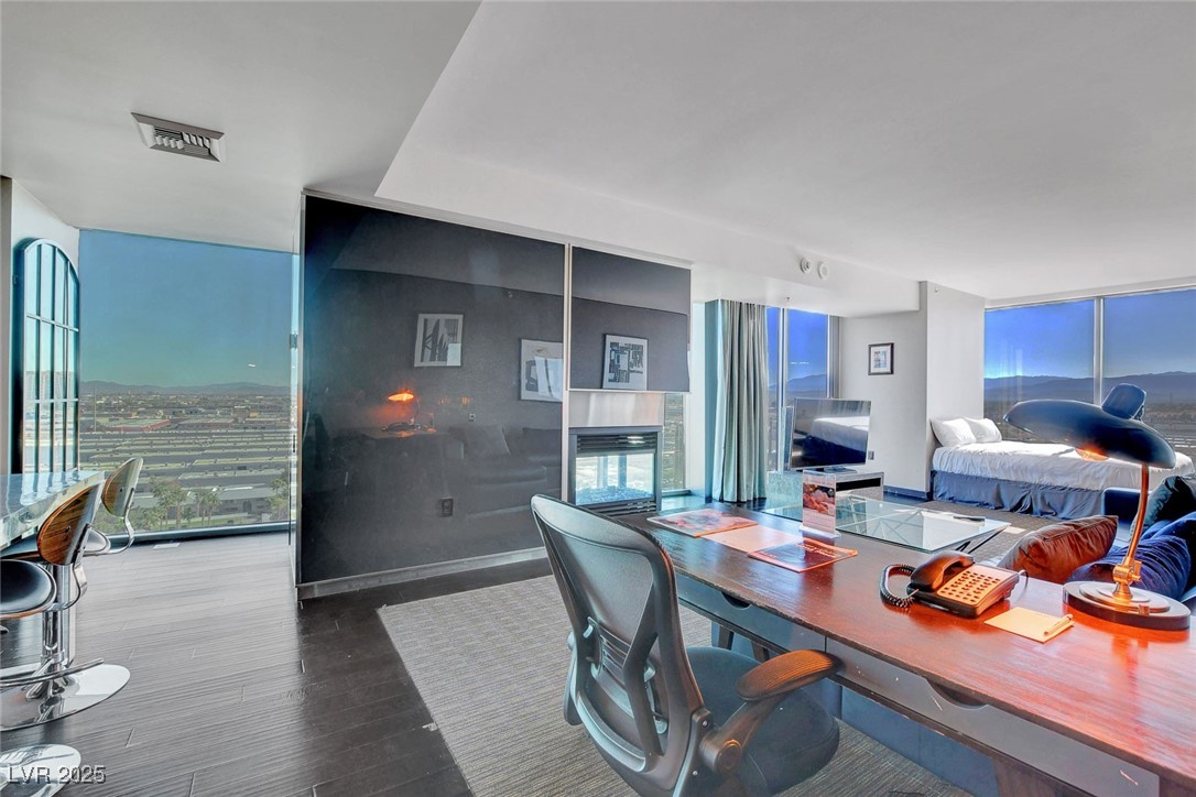4381 West Flamingo Road, Unit 1121 Las Vegas, NV 89103 - Photo 6 of 33 Office space featuring expansive windows and wood finished floors