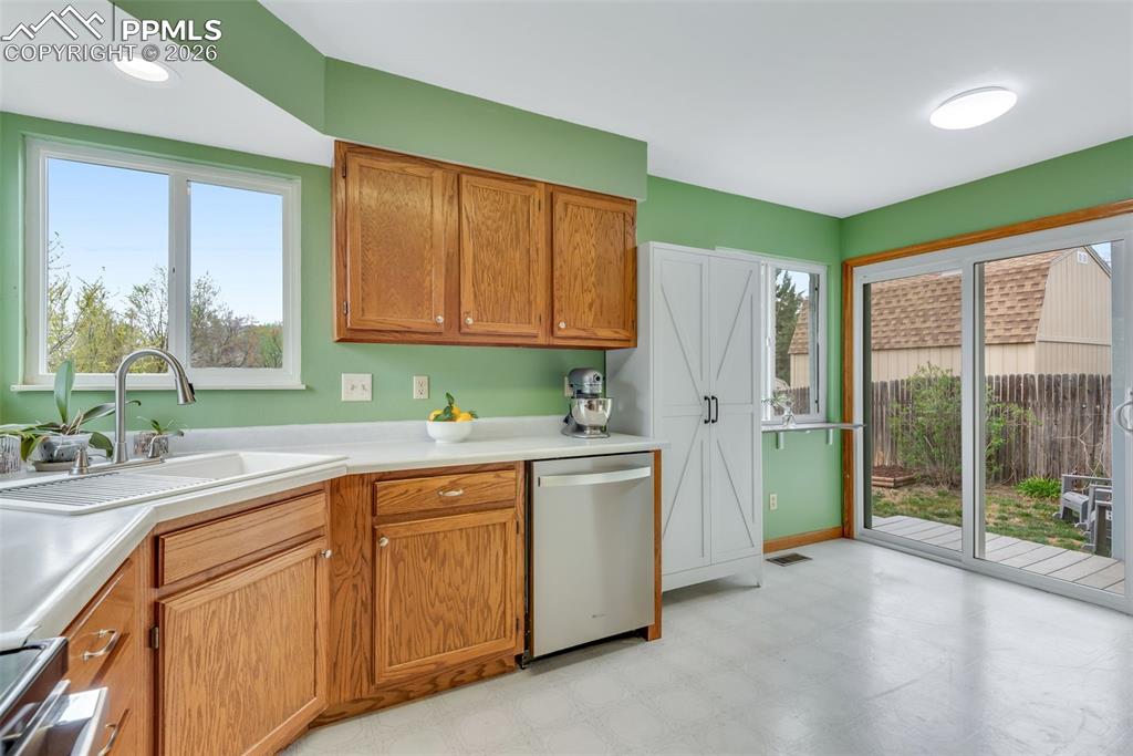 110 Monk Street Colorado Springs, CO 80911 - Photo 17 of 34 a kitchen with a sink and cabinets