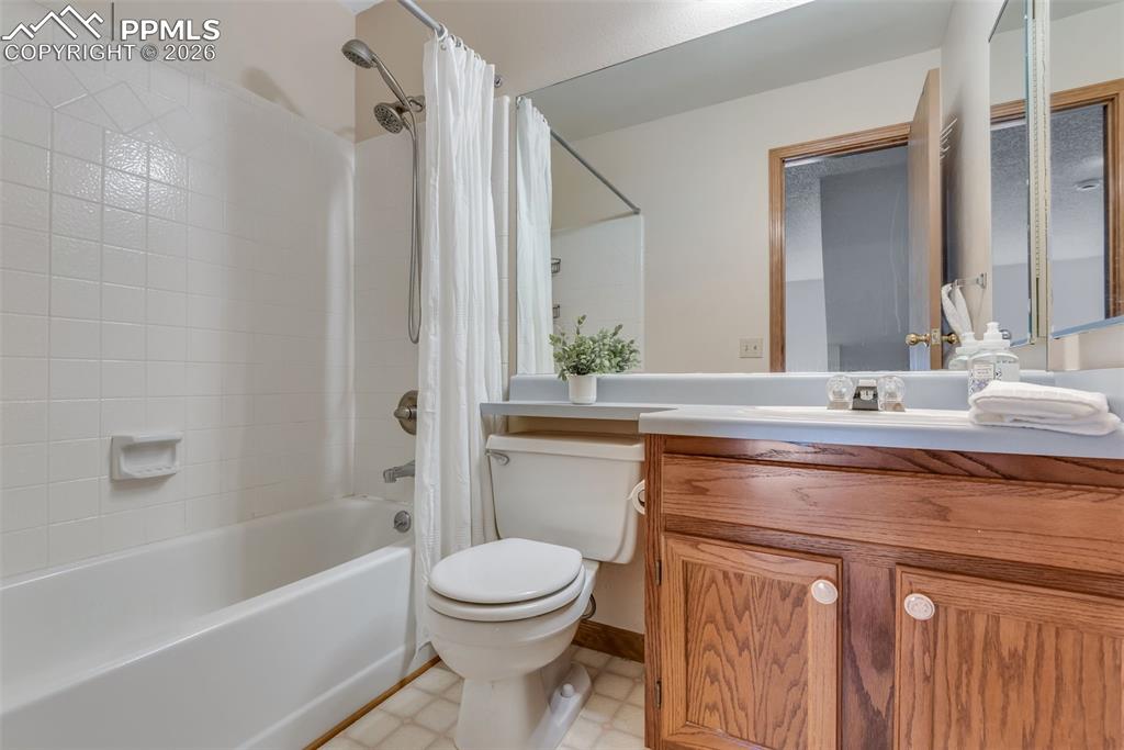 110 Monk Street Colorado Springs, CO 80911 - Photo 27 of 34 a bathroom with a sink a toilet and shower
