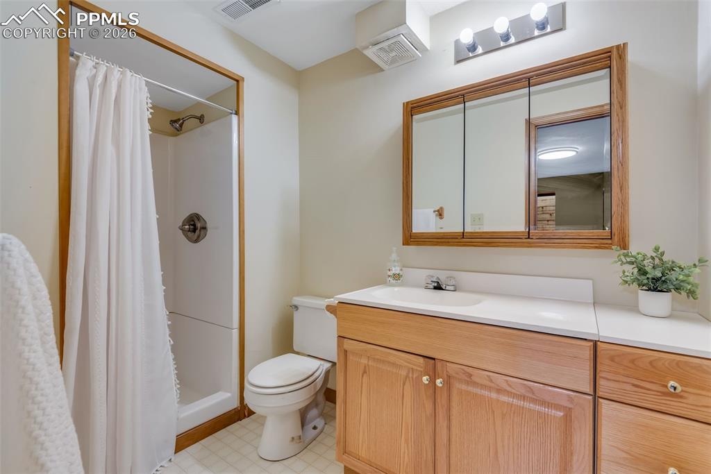 110 Monk Street Colorado Springs, CO 80911 - Photo 31 of 34 a bathroom with a sink a toilet and shower