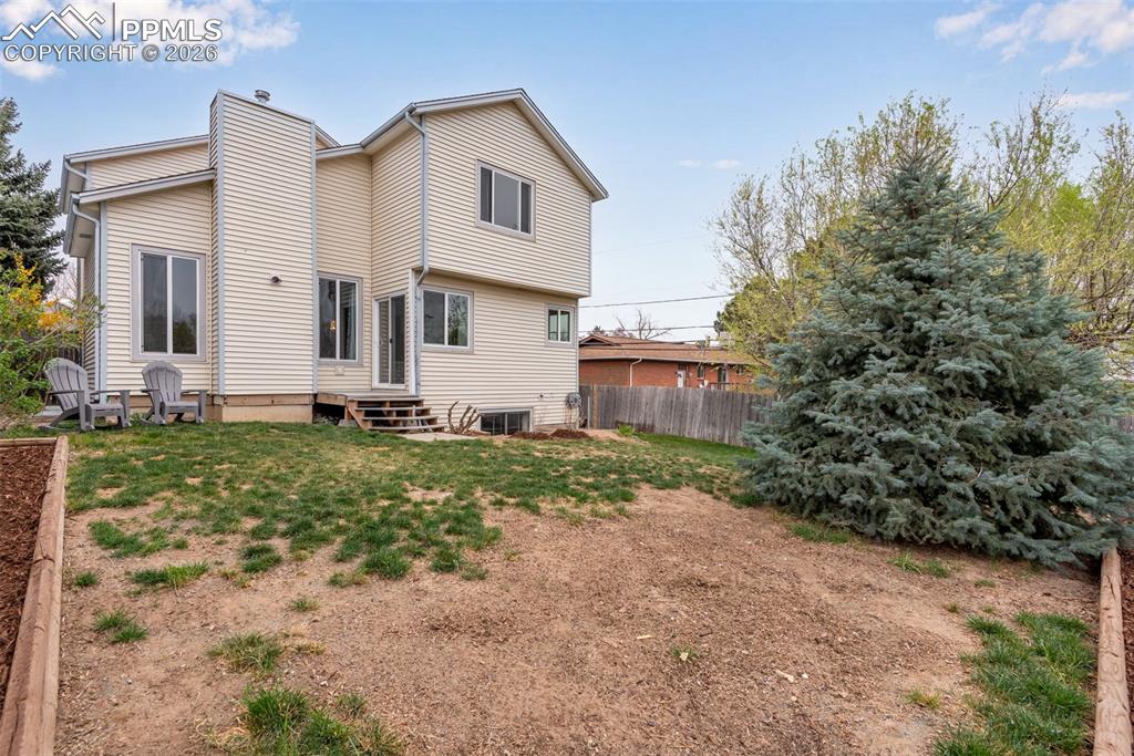 110 Monk Street Colorado Springs, CO 80911 - Photo 4 of 34 a view of a house with backyard and garden
