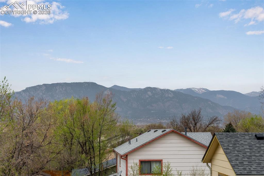 110 Monk Street Colorado Springs, CO 80911 - Photo 6 of 34 a view of a house with a mountain and a forest