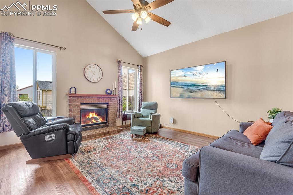 110 Monk Street Colorado Springs, CO 80911 - Photo 9 of 34 a living room with furniture and a fireplace