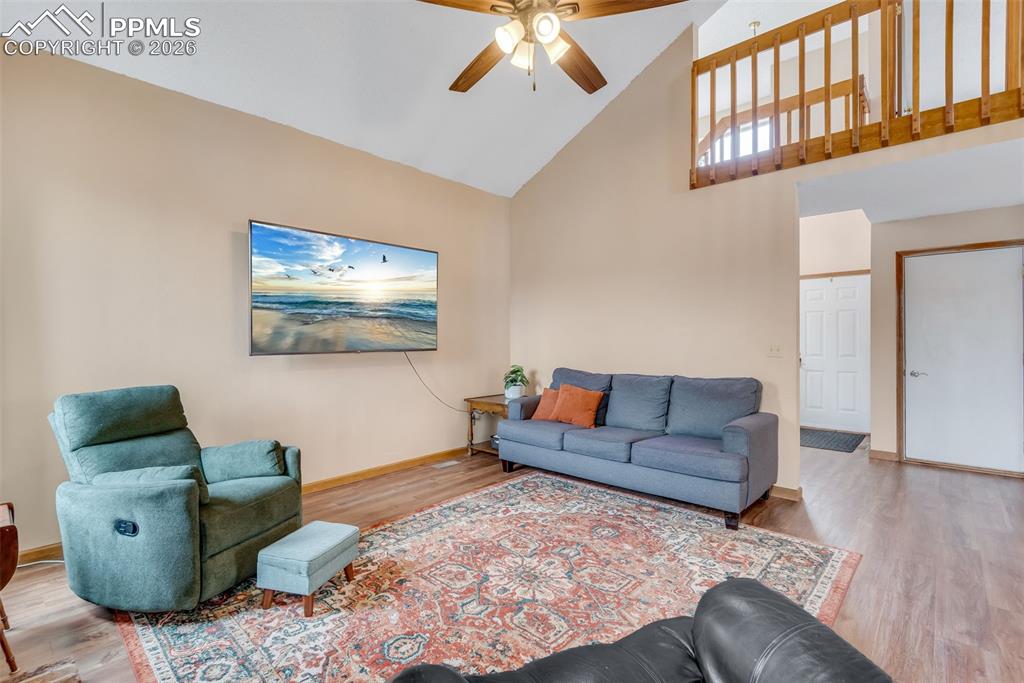 110 Monk Street Colorado Springs, CO 80911 - Photo 10 of 34 a living room with furniture and wooden floor