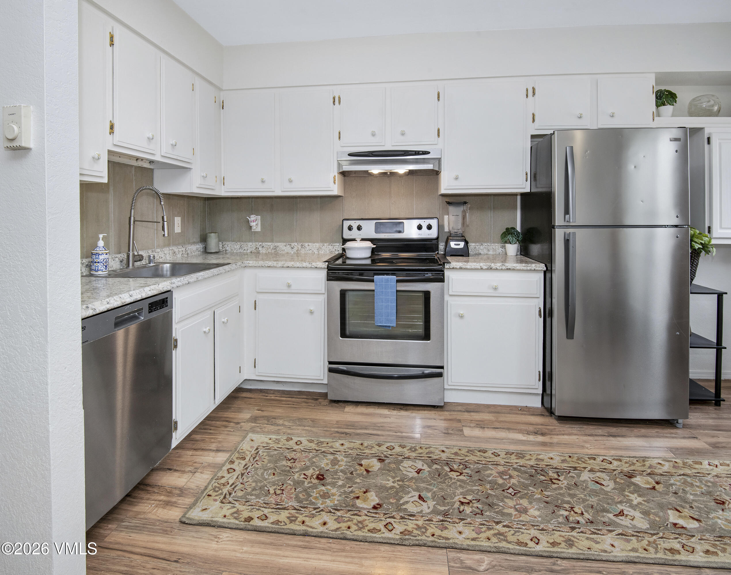 85 Chambers Avenue, Unit 10 Eagle, CO 81631 - Photo 5 of 41 a kitchen with a stove top oven and refrigerator