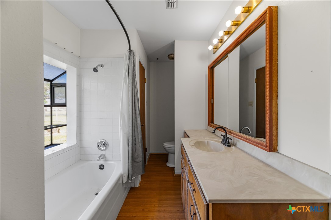 20 Hambleton Road Victoria, TX 77905 - Photo 25 of 48 a bathroom with a tub sink and mirror