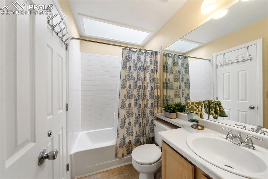 5805 Dutchess Drive Colorado Springs, CO 80923 - Photo 17 of 34 a bathroom with a sink a toilet and shower