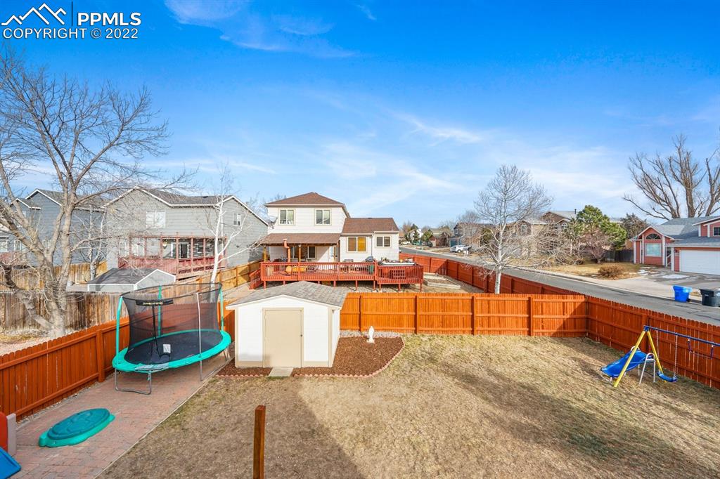 5805 Dutchess Drive Colorado Springs, CO 80923 - Photo 24 of 34 a view of a swimming pool with a lounge chair