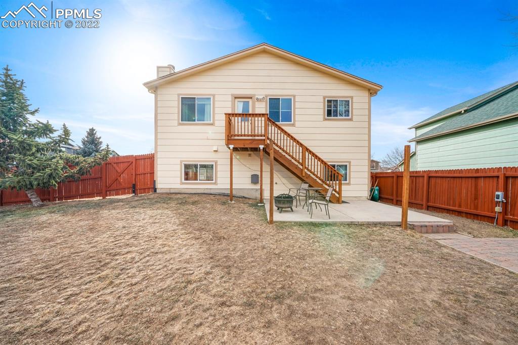 5805 Dutchess Drive Colorado Springs, CO 80923 - Photo 27 of 34 a view of a house with a yard