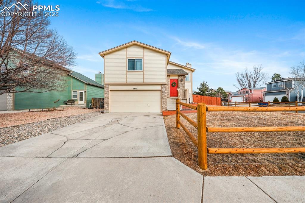 5805 Dutchess Drive Colorado Springs, CO 80923 - Photo 28 of 34 a front view of a house with a yard
