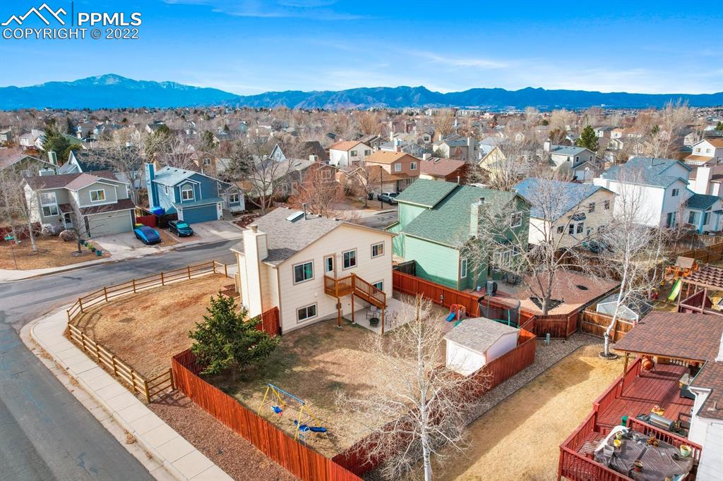 5805 Dutchess Drive Colorado Springs, CO 80923 - Photo 33 of 34 an aerial view of a house with a lake view