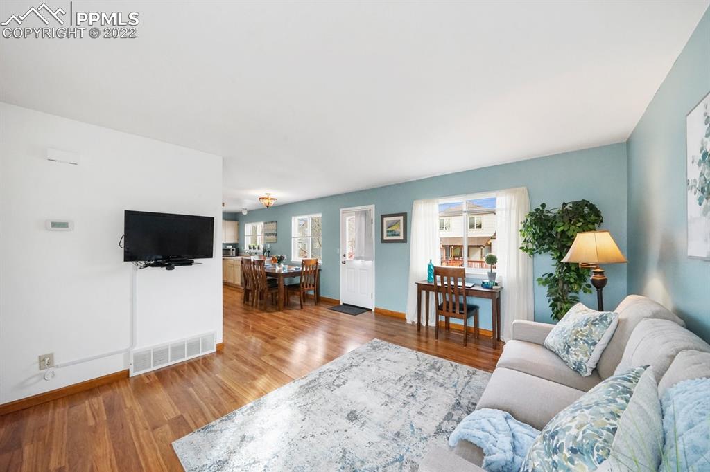 5805 Dutchess Drive Colorado Springs, CO 80923 - Photo 4 of 34 a living room with furniture and a flat screen tv