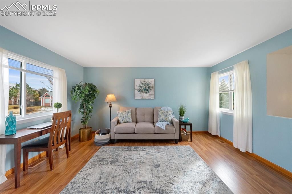 5805 Dutchess Drive Colorado Springs, CO 80923 - Photo 6 of 34 a living room with furniture and a large window