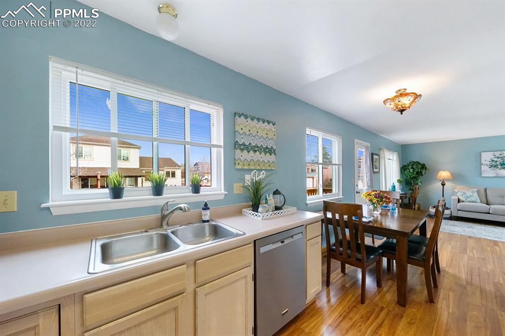 5805 Dutchess Drive Colorado Springs, CO 80923 - Photo 10 of 34 a kitchen with a dining table chairs and window